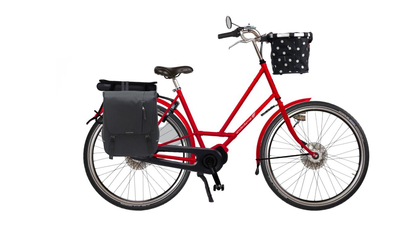 City Zen électrique rouge brillant avec sacoche à l'arrière et panier à l'avant