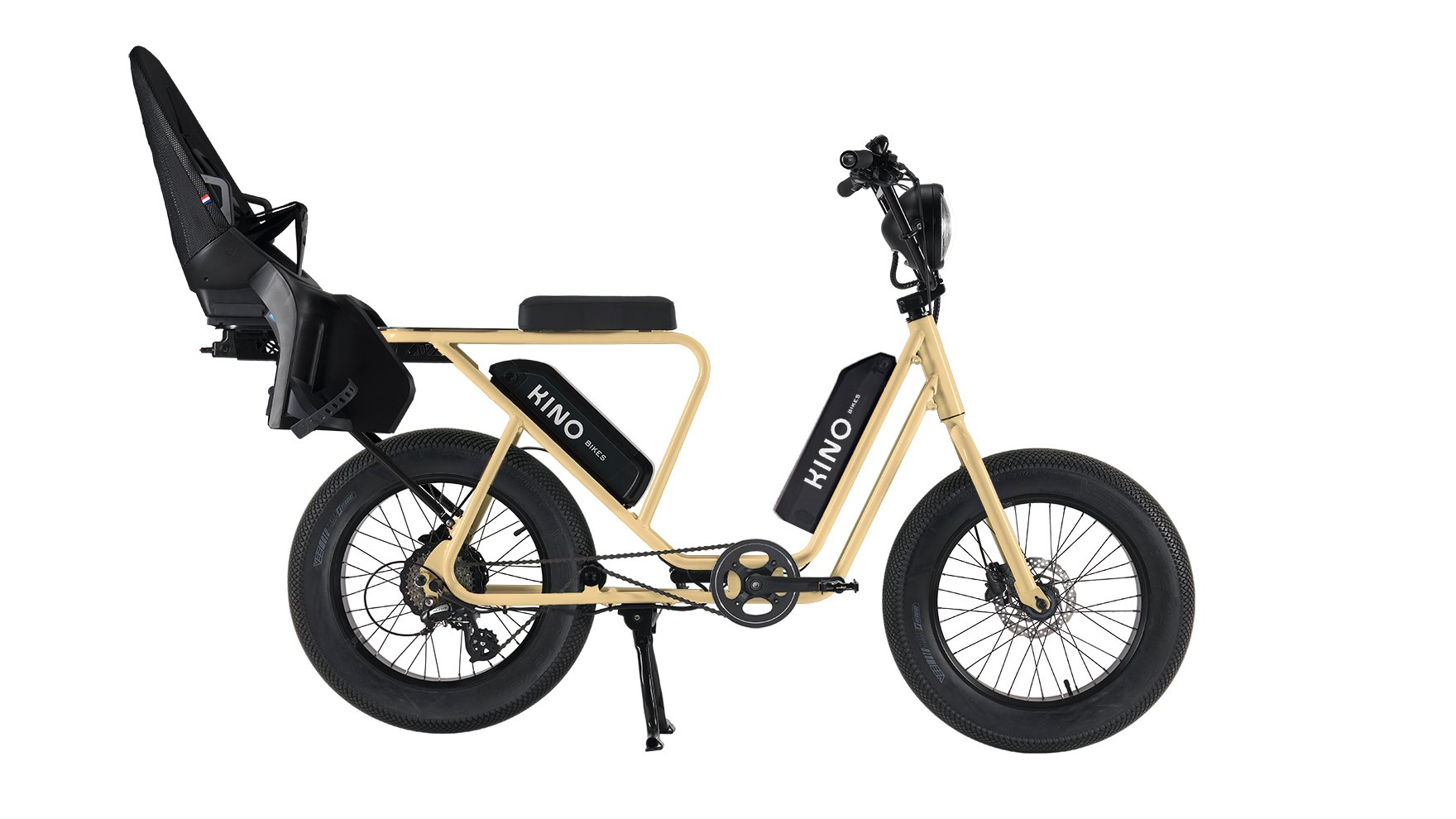 Vélo avec cadre beige, batterie supplémentaire et siège enfant sur l'extension arrière