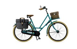 City Zen avec cadre bleu pétrole, porte-bagage avant avec malle et sacoche sur le porte-bagage arrière